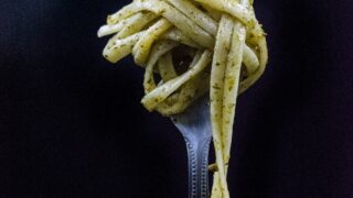 selective focus photography of fork with noodle